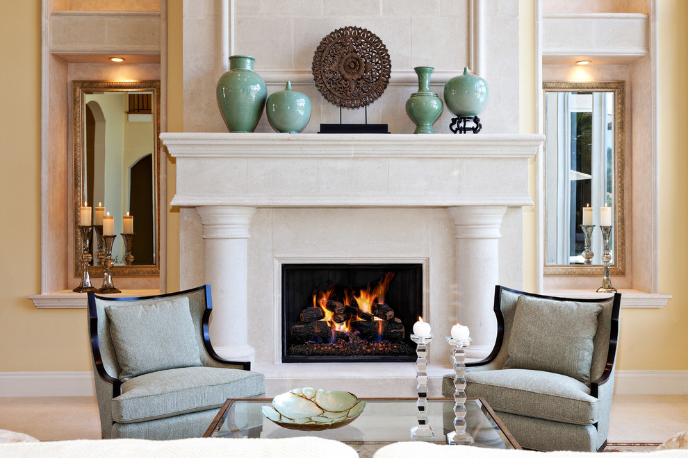 Example of a mid-sized tuscan formal and enclosed living room design in Miami with a stone fireplace, yellow walls, a standard fireplace and no tv
