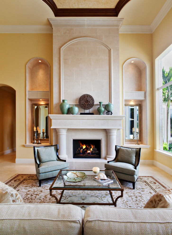Design ideas for a mediterranean living room in Miami with yellow walls.
