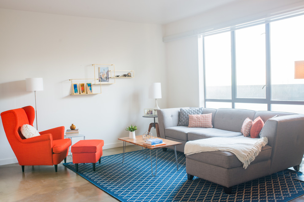 Foto di un soggiorno minimalista di medie dimensioni e aperto con pareti bianche