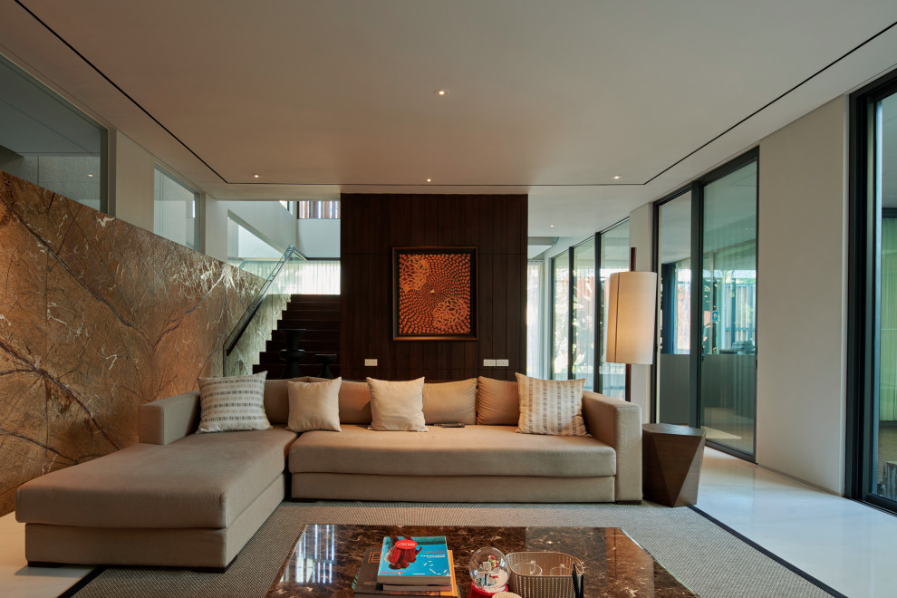 Example of a trendy white floor living room design in Singapore with white walls