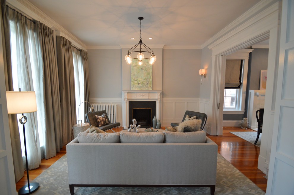 Inspiration for a large traditional formal open plan living room in Richmond with grey walls, medium hardwood flooring, a standard fireplace, a metal fireplace surround, no tv and brown floors.