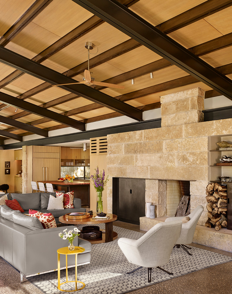 Trendy open concept living room photo in Houston with white walls, a standard fireplace and a stone fireplace