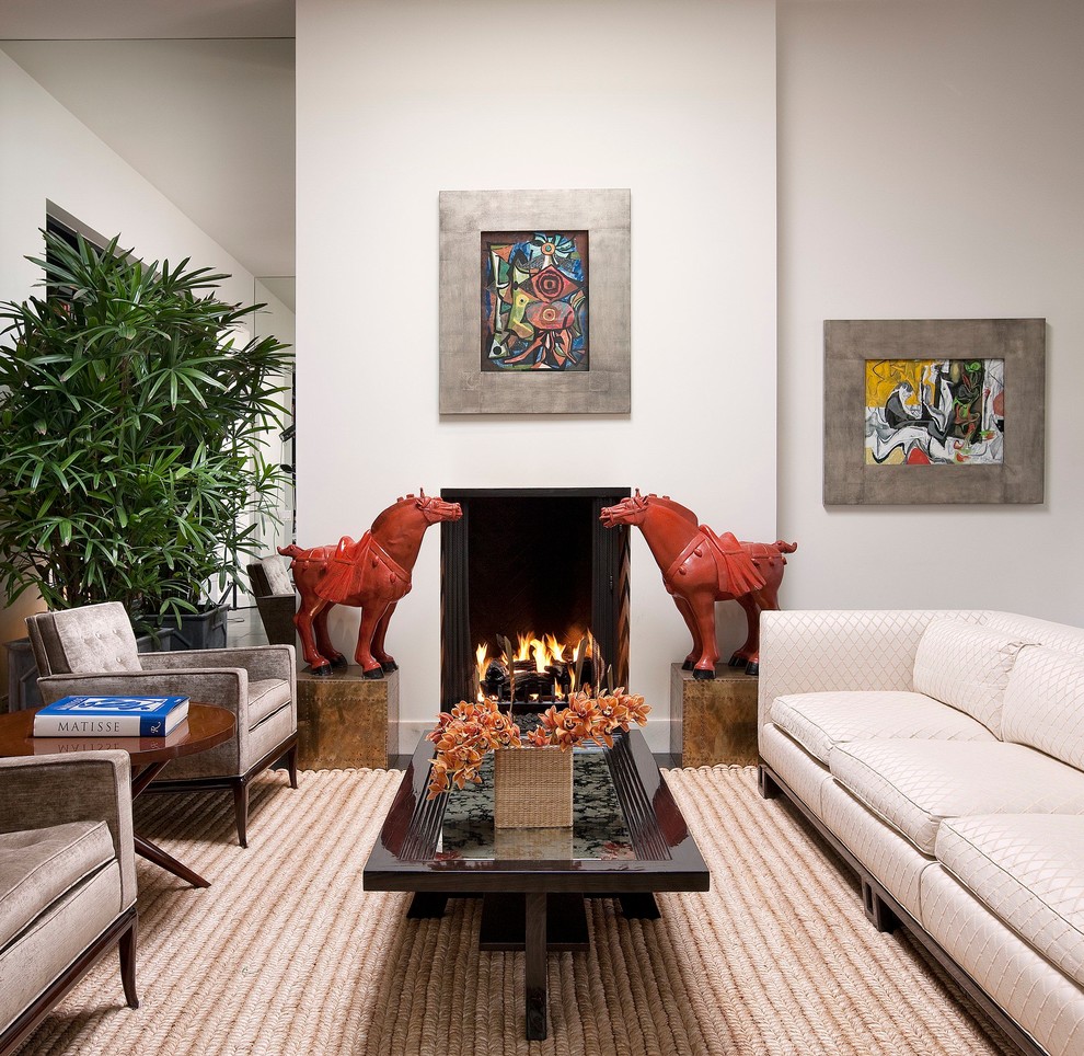 Example of a trendy living room design in Santa Barbara with white walls