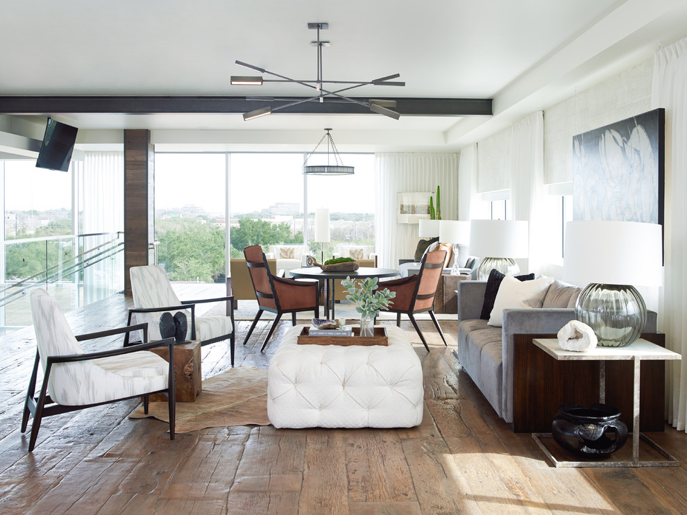 Trendy formal and open concept medium tone wood floor living room photo in Houston