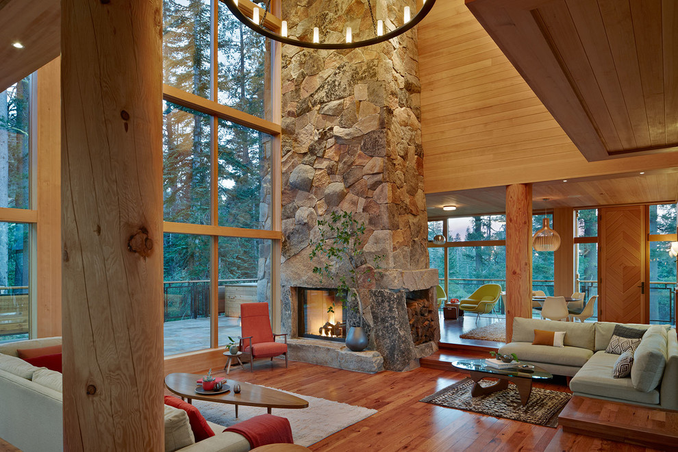 Huge mountain style open concept living room photo in San Francisco with a stone fireplace and a corner fireplace