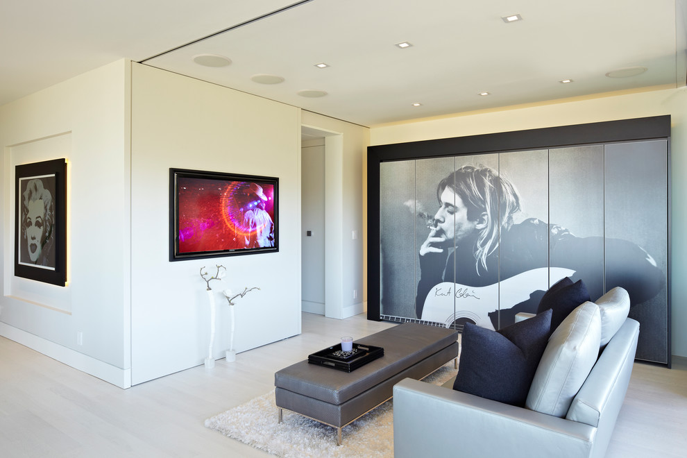 Mid-sized trendy open concept white floor living room photo in Los Angeles with white walls, a wall-mounted tv and no fireplace