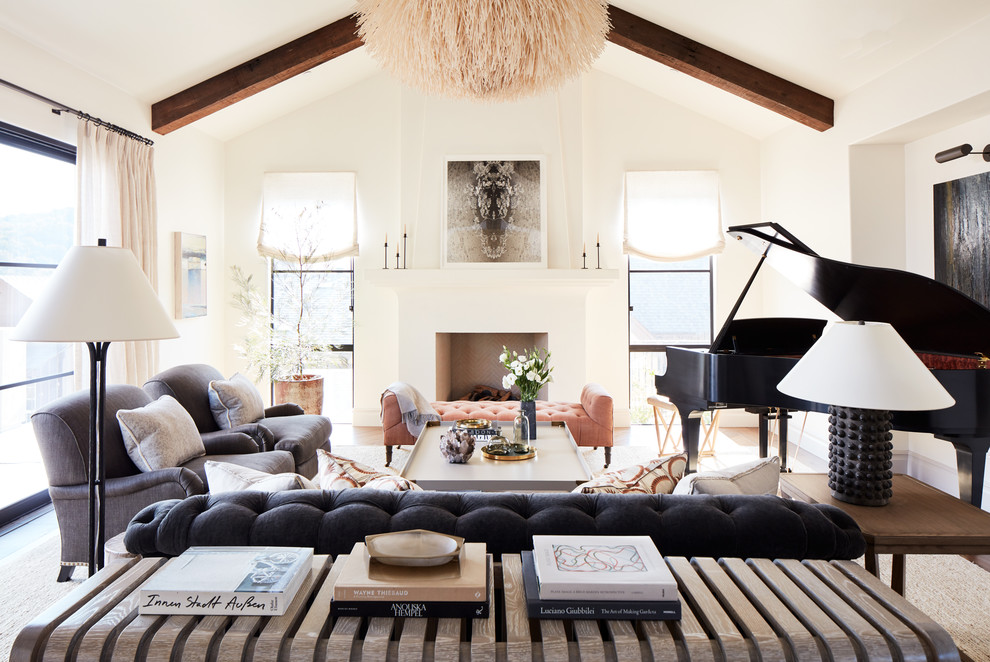 Design ideas for a large rural formal and cream and black open plan living room in San Francisco with white walls, light hardwood flooring, a standard fireplace, a plastered fireplace surround and no tv.