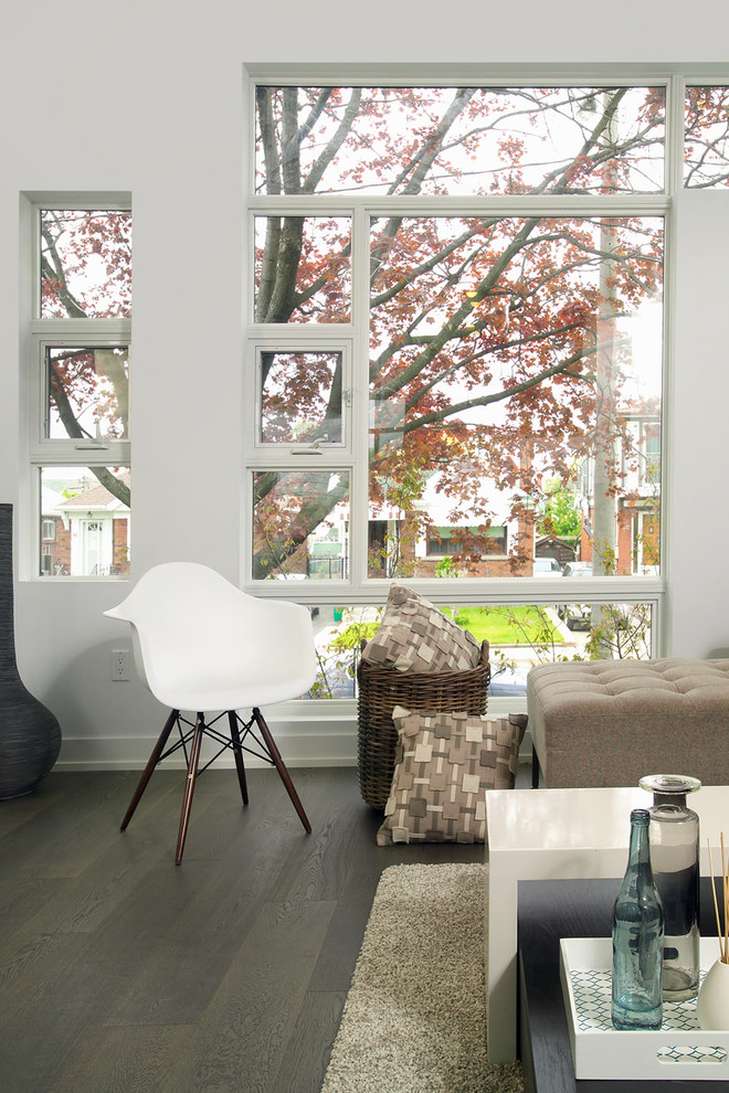 This is an example of a modern living room in Toronto with white walls.
