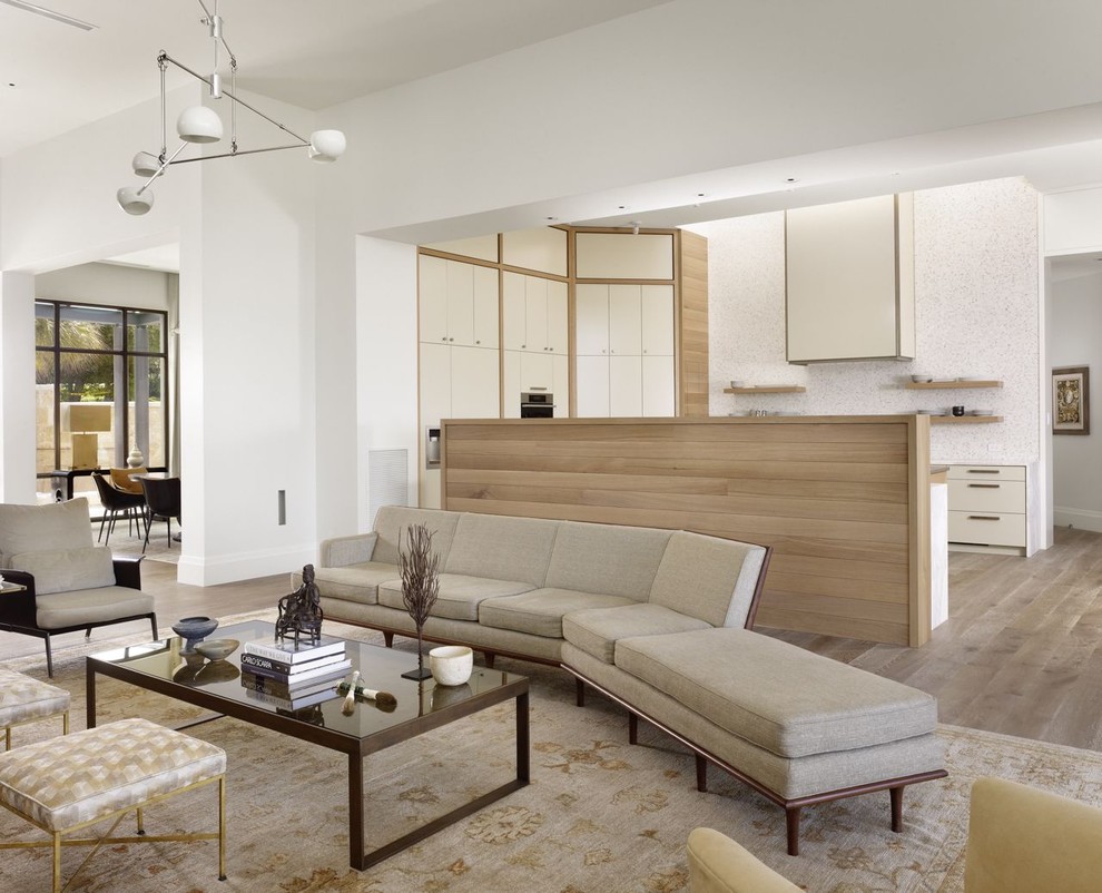 Inspiration for a contemporary open concept living room remodel in Austin with white walls