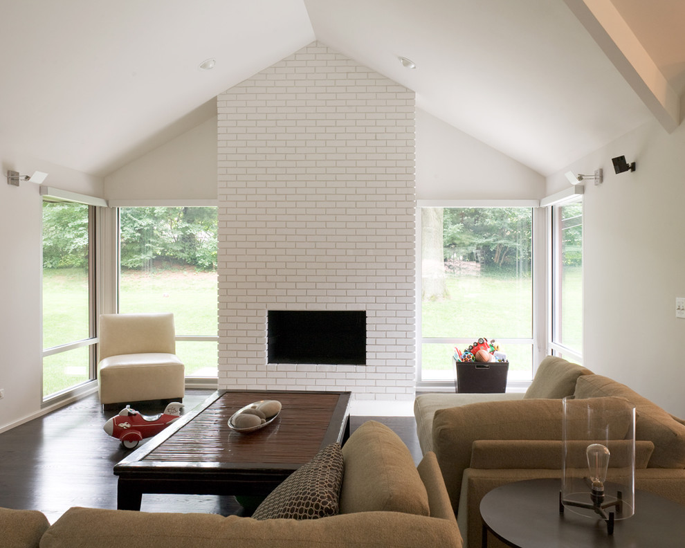 Living room - 1960s dark wood floor living room idea in Kansas City with a brick fireplace, white walls and a ribbon fireplace
