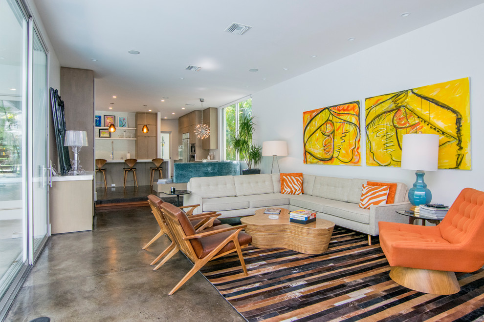Living room - mid-sized mid-century modern open concept and formal concrete floor and brown floor living room idea in Tampa with white walls, no fireplace and a tv stand