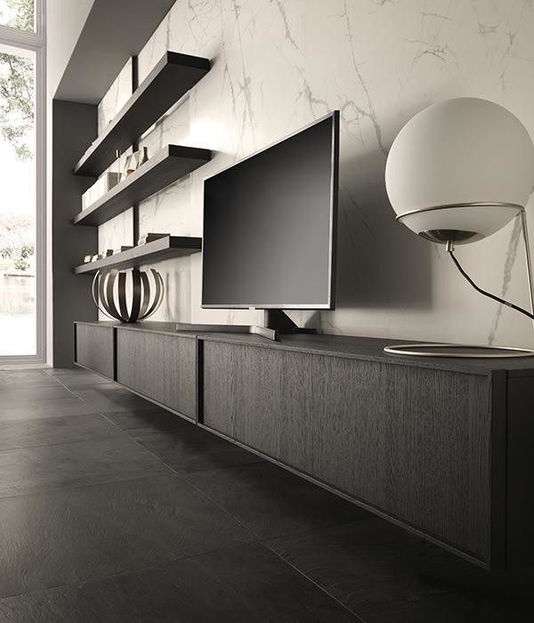 Inspiration pour un salon minimaliste avec un téléviseur encastré.