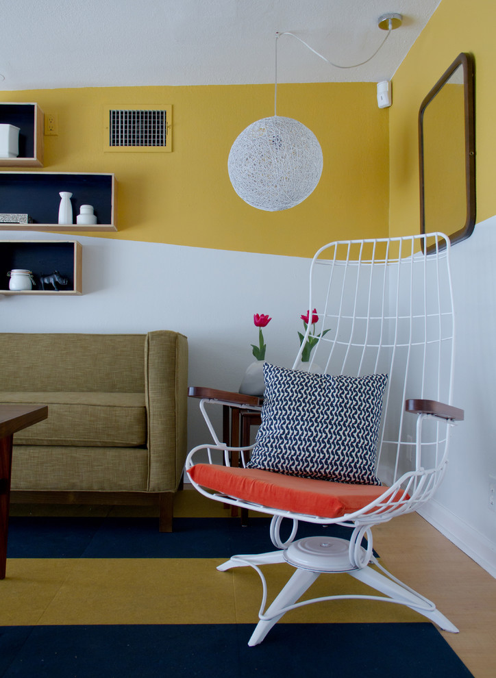 Living room - eclectic living room idea in Los Angeles with yellow walls