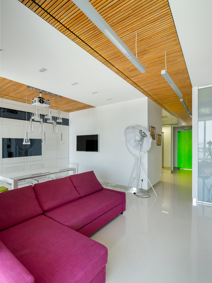 На фото: открытая, объединенная гостиная комната среднего размера в современном стиле с белыми стенами, полом из винила и белым полом без телевизора с