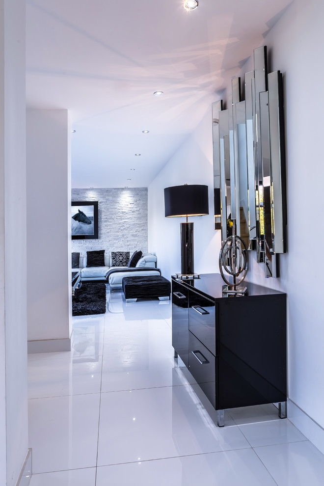 This is an example of a contemporary living room in Cardiff with white walls.
