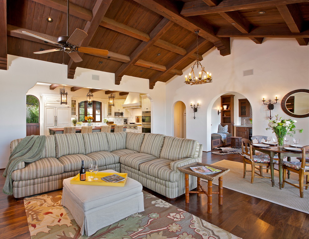 Photo of a mediterranean formal open plan living room in Santa Barbara with white walls and dark hardwood flooring.