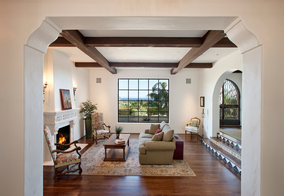 Design ideas for a mediterranean living room in Santa Barbara with white walls.