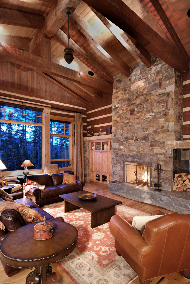 Medium sized rustic formal open plan living room in Other with light hardwood flooring, a stone fireplace surround and brown walls.