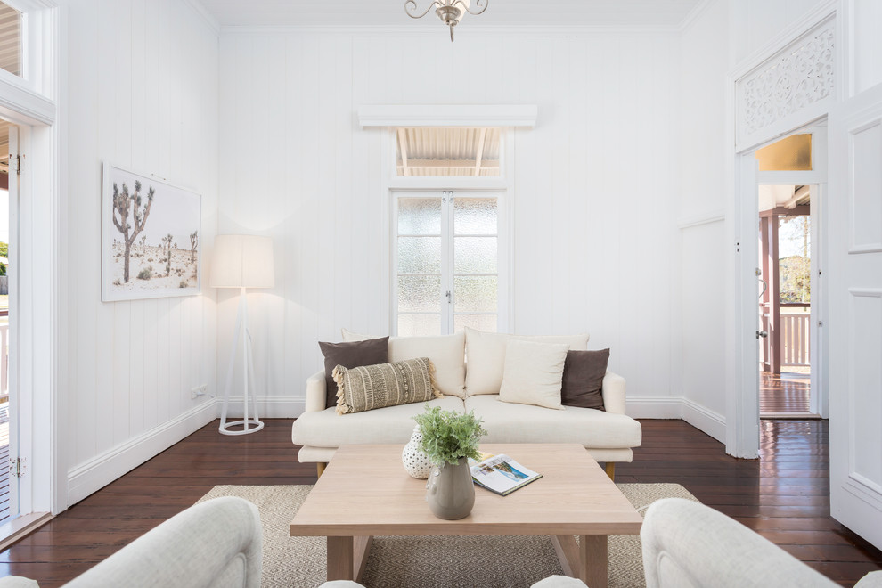 Living room - scandinavian formal and enclosed dark wood floor and brown floor living room idea in Brisbane with white walls
