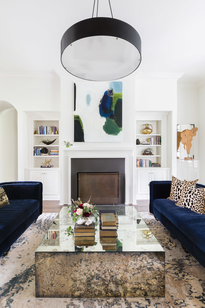Photo of a contemporary living room in Nashville with white walls and a standard fireplace.