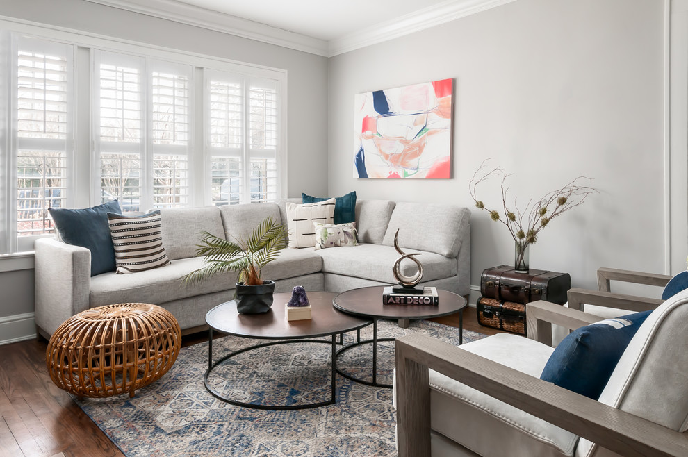 Living room - mid-sized scandinavian open concept medium tone wood floor and brown floor living room idea in Atlanta with gray walls