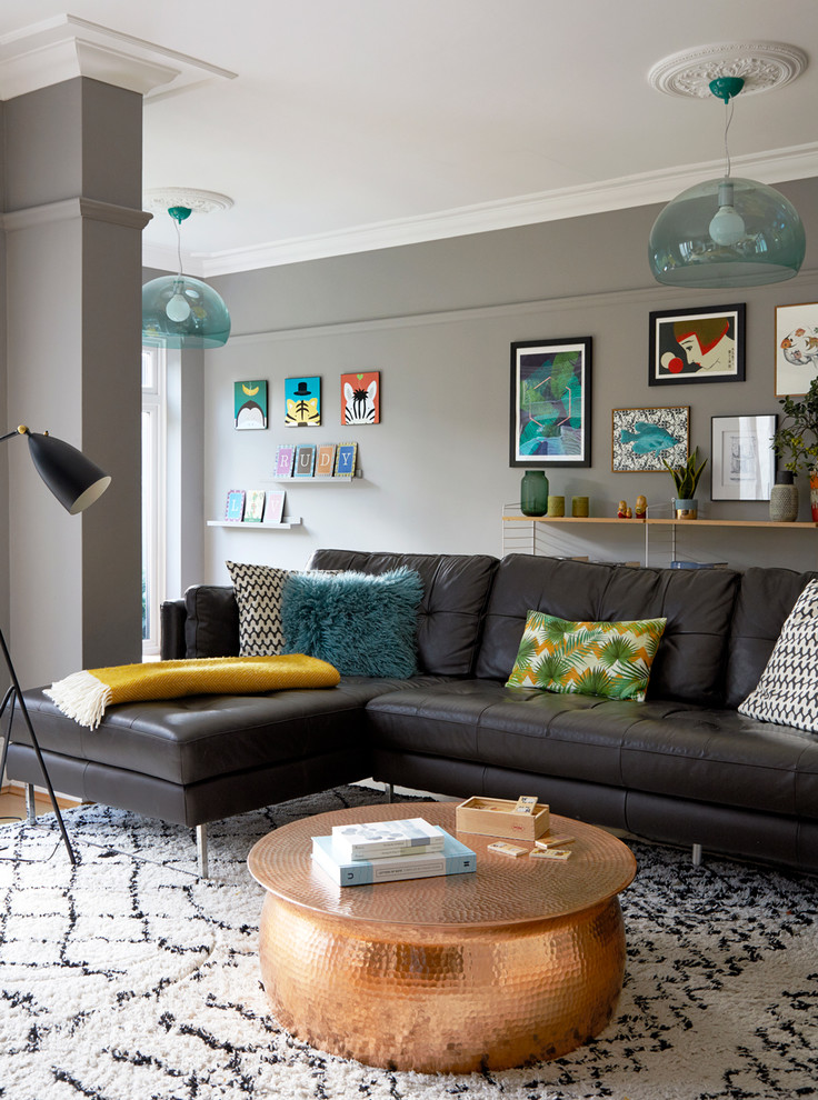 This is an example of a contemporary living room in Essex with grey walls.