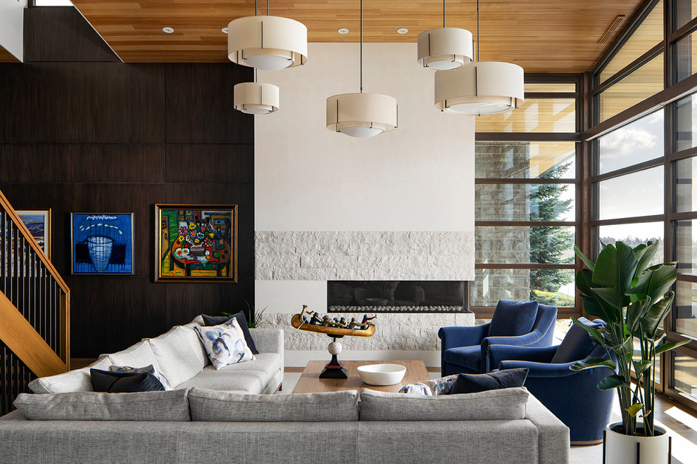 Contemporary living room in Calgary with white walls, medium hardwood flooring, a ribbon fireplace and brown floors.