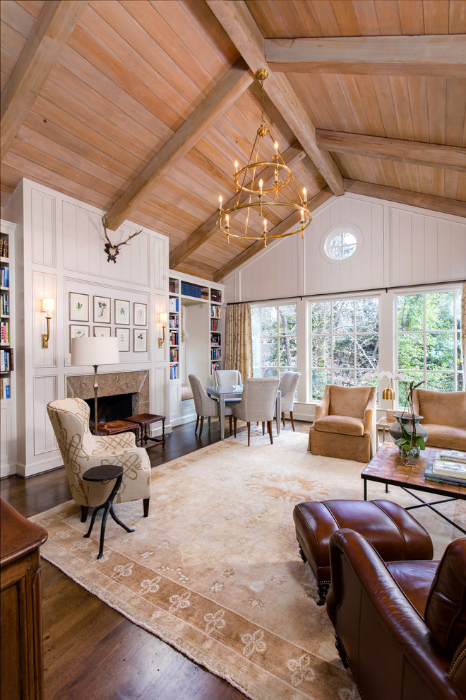 Example of a large french country formal and open concept dark wood floor and brown floor living room design in Birmingham with white walls, a standard fireplace, a tile fireplace and no tv