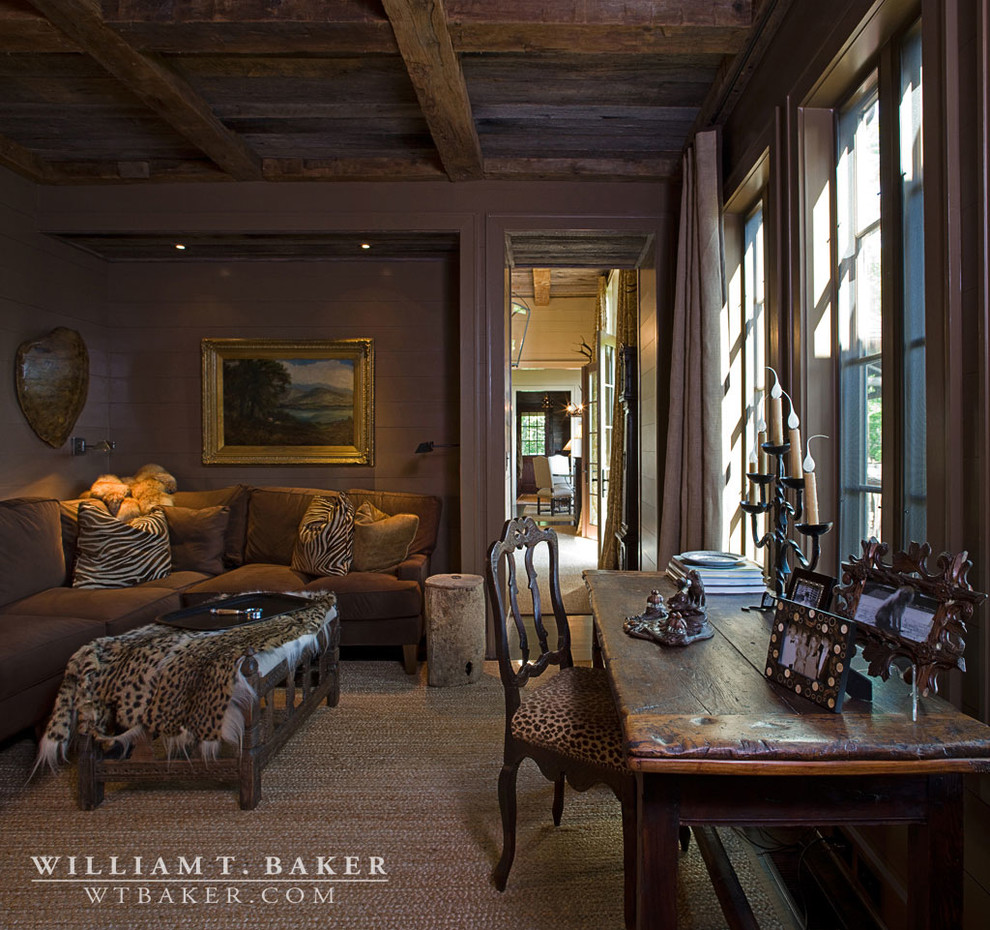 Photo of a medium sized rustic enclosed living room in Atlanta with brown walls, dark hardwood flooring and a concealed tv.