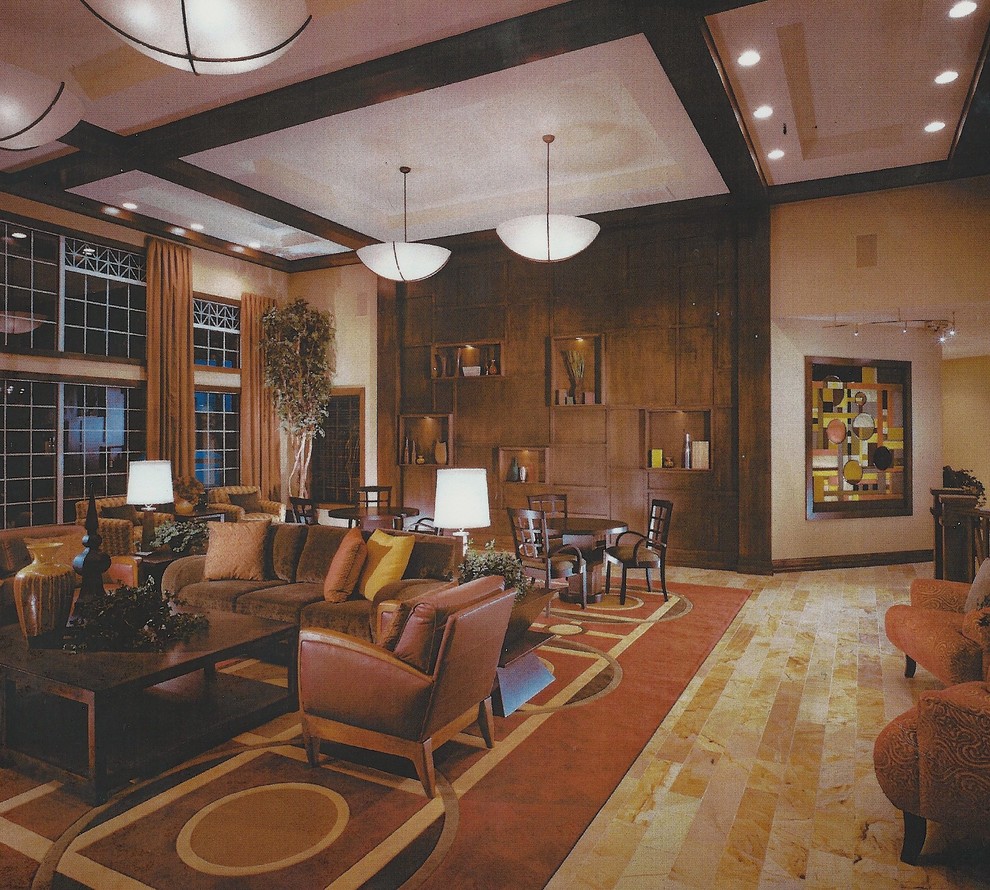 Aménagement d'un grand salon craftsman ouvert avec une salle de réception, un mur beige, un sol en calcaire, une cheminée standard et un manteau de cheminée en pierre.