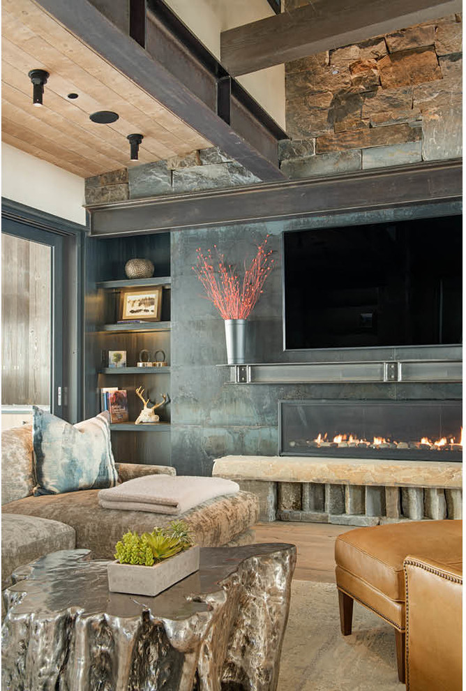 Inspiration for a large rustic open plan living room in Other with a home bar, a ribbon fireplace, a stone fireplace surround, a wall mounted tv, beige walls, medium hardwood flooring and brown floors.