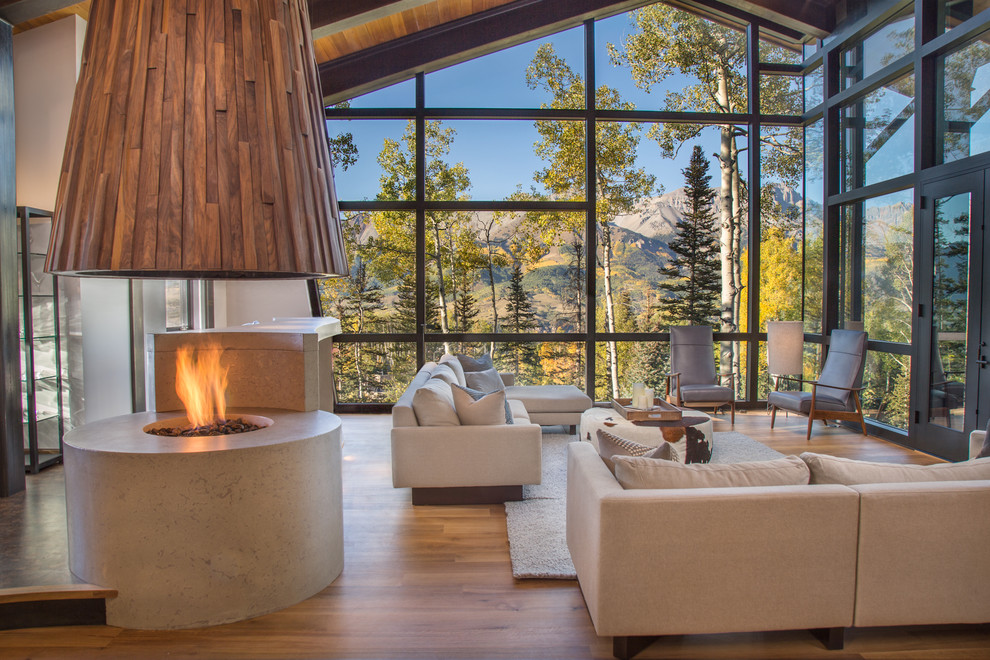 Inspiration for a rustic open plan living room in Denver with medium hardwood flooring.