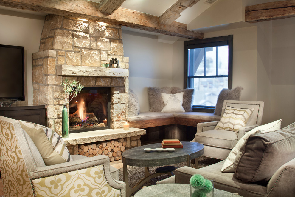 Living room - rustic living room idea in Denver with a standard fireplace and a stone fireplace