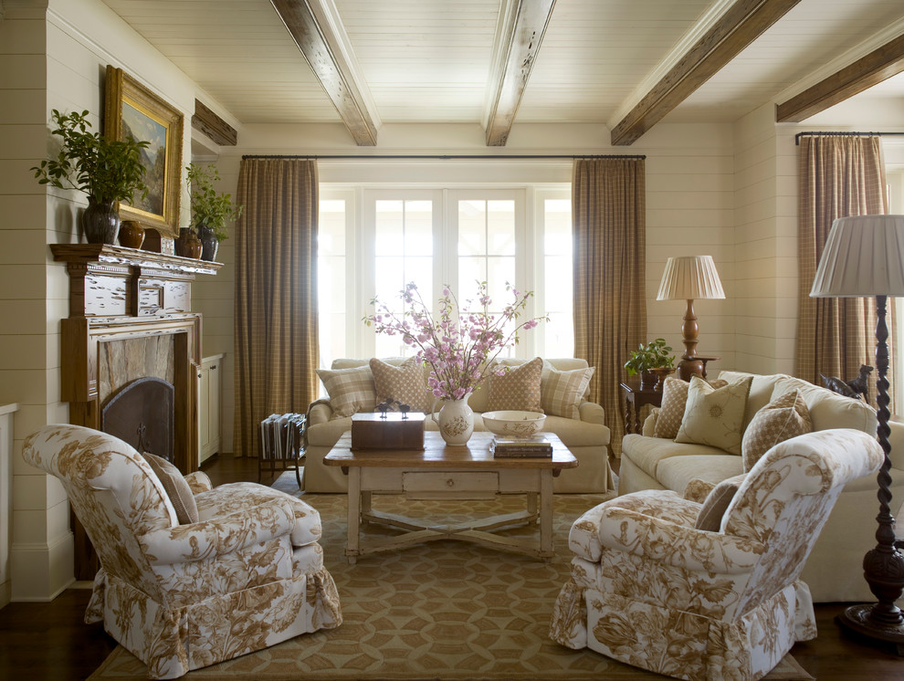Example of a large classic open concept dark wood floor living room design in Raleigh with white walls, a standard fireplace and a wood fireplace surround