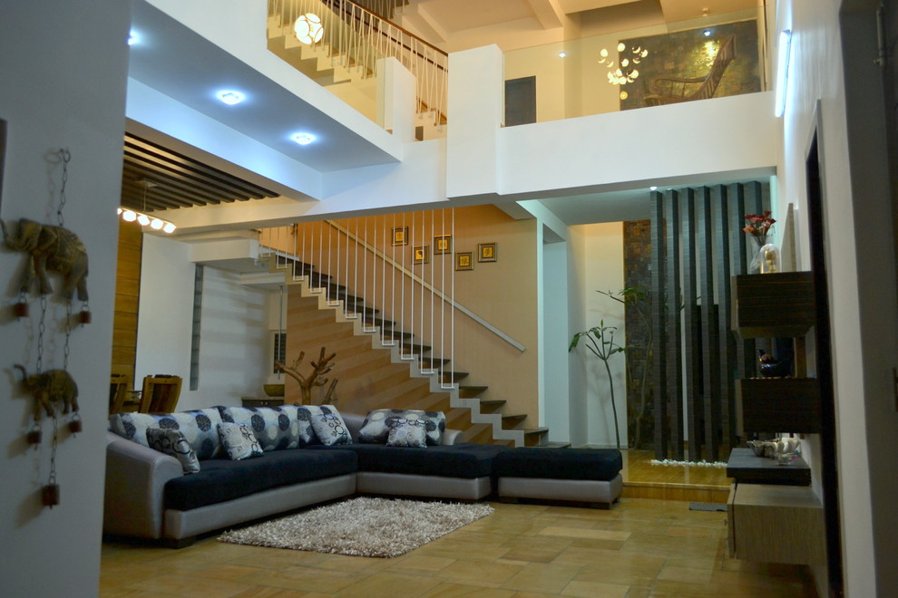 Example of a trendy living room design in Bengaluru