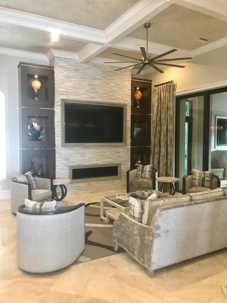 Photo of an expansive contemporary formal open plan living room in Miami with beige walls, marble flooring, a standard fireplace, a stone fireplace surround, a wall mounted tv and white floors.