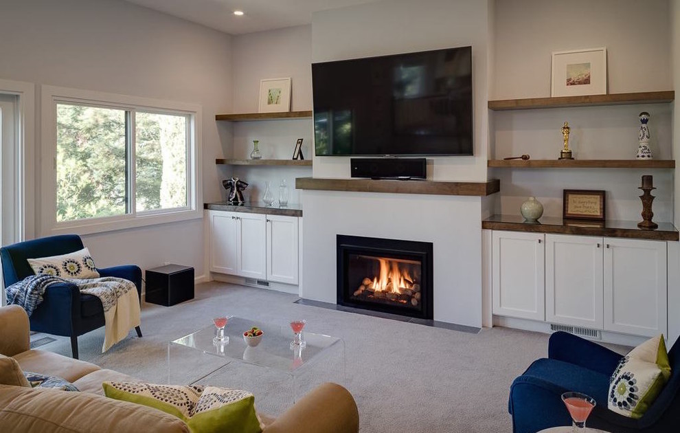 Mid-sized transitional formal and open concept carpeted living room photo in San Francisco with white walls, a standard fireplace, a plaster fireplace and a wall-mounted tv
