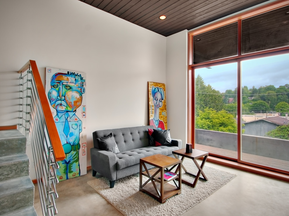 Идея дизайна: гостиная комната в стиле модернизм с белыми стенами и бетонным полом