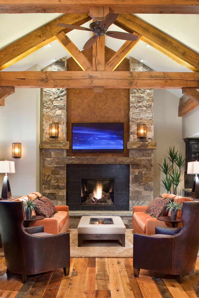 Living room - rustic living room idea in Denver with a standard fireplace and a tile fireplace