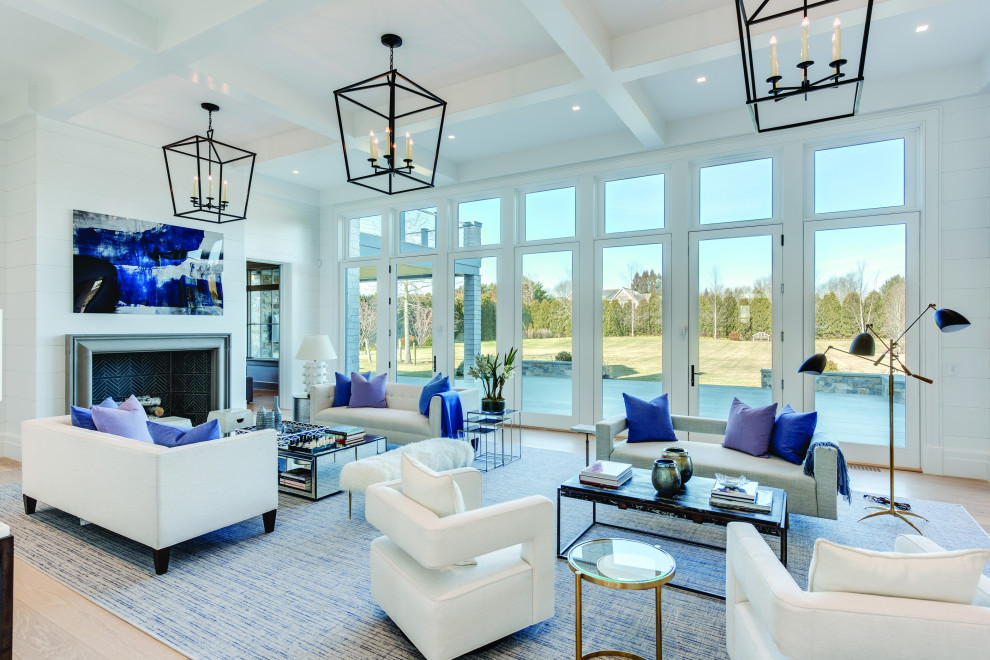 Aménagement d'un très grand salon contemporain ouvert avec un mur blanc, moquette, une cheminée standard, un manteau de cheminée en pierre et un sol bleu.