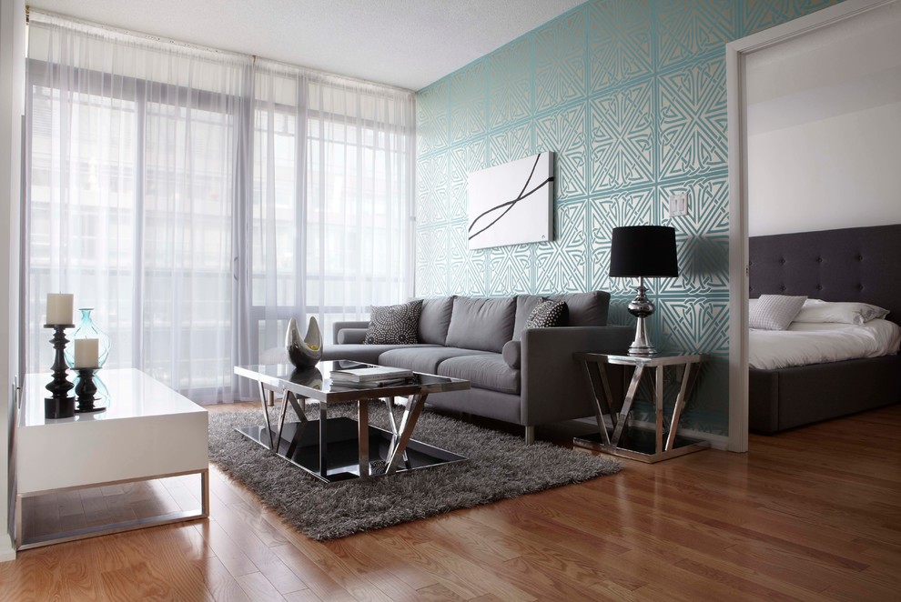 Inspiration for a medium sized contemporary living room in Calgary with medium hardwood flooring.
