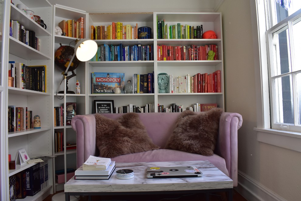 Example of a small cottage chic open concept living room library design in San Francisco with beige walls and no tv