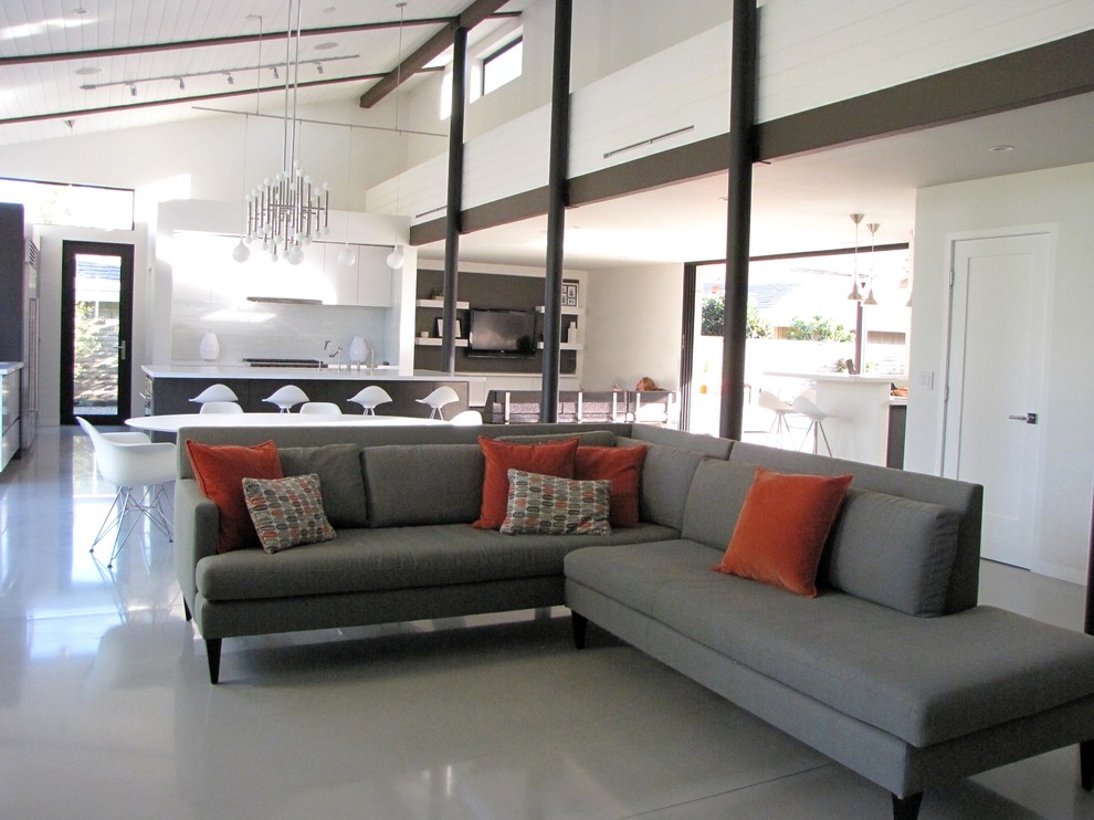 Inspiration for a retro open plan living room in Orange County with white walls.