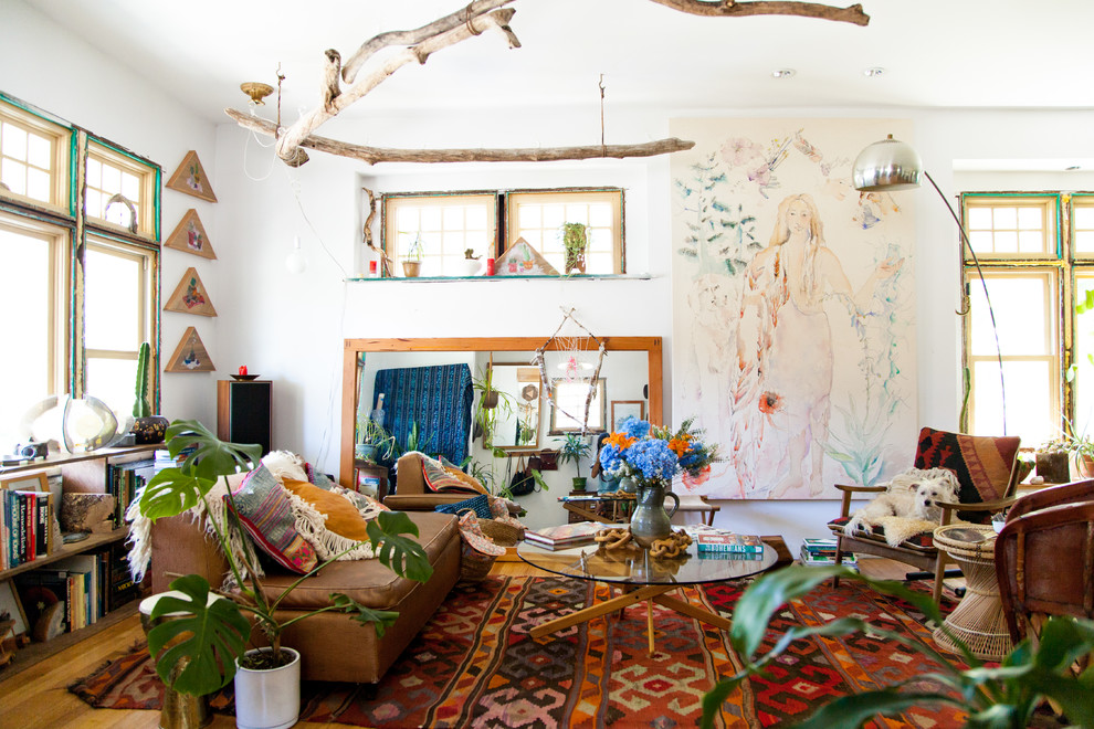Inspiration for an eclectic medium tone wood floor living room remodel in Seattle with white walls and no tv