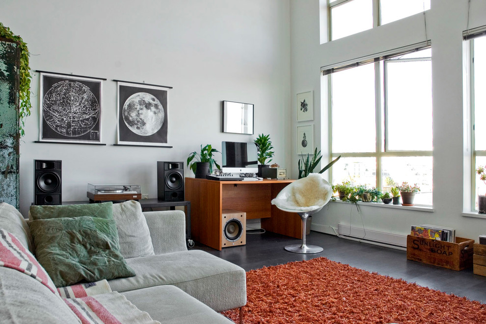 Example of an eclectic living room design in Vancouver with white walls