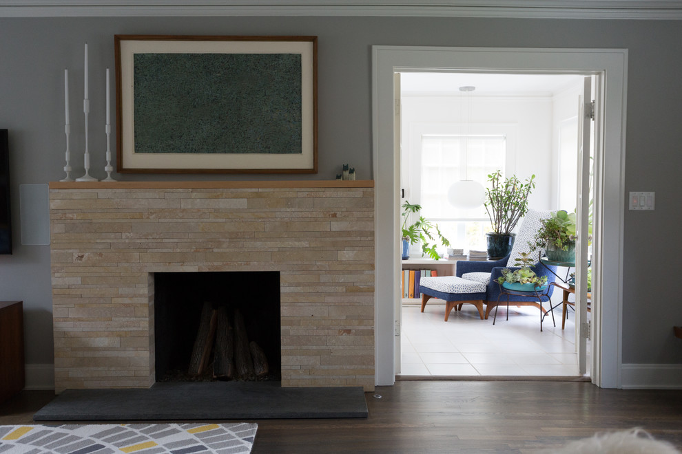 Living room - transitional living room idea in Kansas City with a standard fireplace and a wall-mounted tv