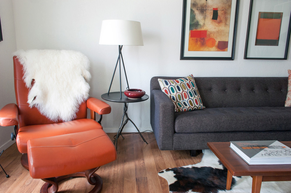 Inspiration for a 1950s medium tone wood floor living room remodel in Dallas with white walls