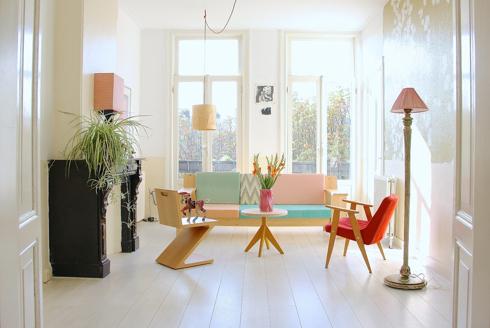 Living room - scandinavian white floor living room idea in Amsterdam with white walls