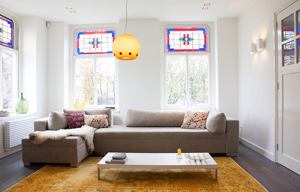 Trendy living room photo in Amsterdam with white walls