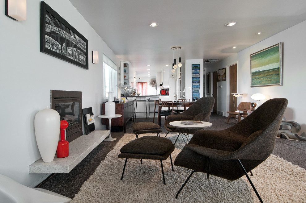 This is an example of a midcentury living room in Salt Lake City with white walls.